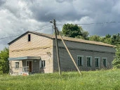 Имущественный комплекс в составе земельного участка общей площадью 11 618 кв.м. и 8 зданий и сооружений общей площадью 983,5 кв.м.